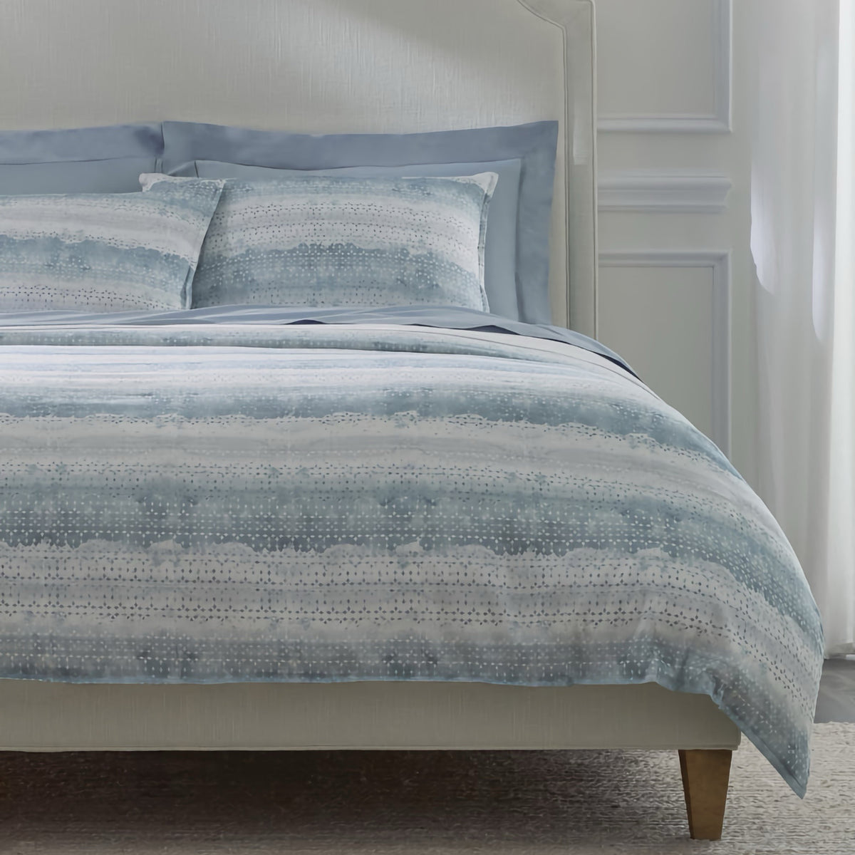 Closeup of Sferra Brillanti Duvet Cover and Shams in Sky color