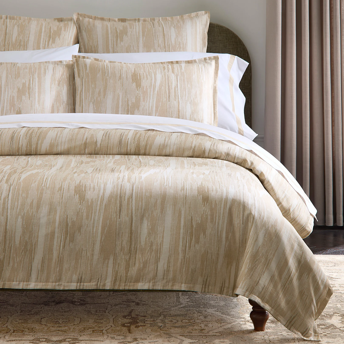 Corner View of Sferra Brina Duvet Cover and Shams in Sand color