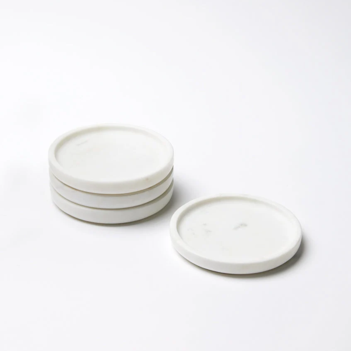 A Set of White Sferra Calanna Coasters