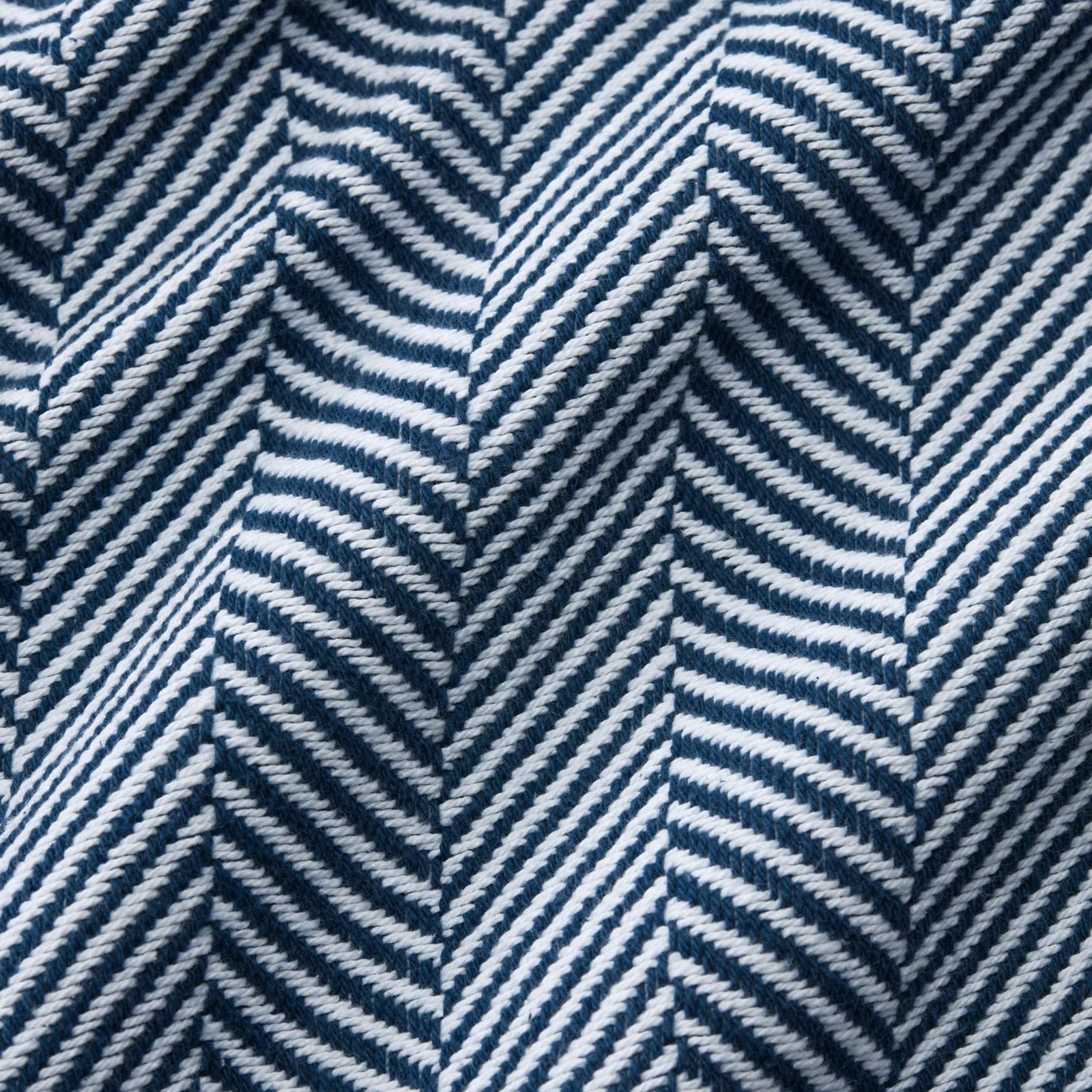 Folded Sferra Camilo Blanket in White/Navy