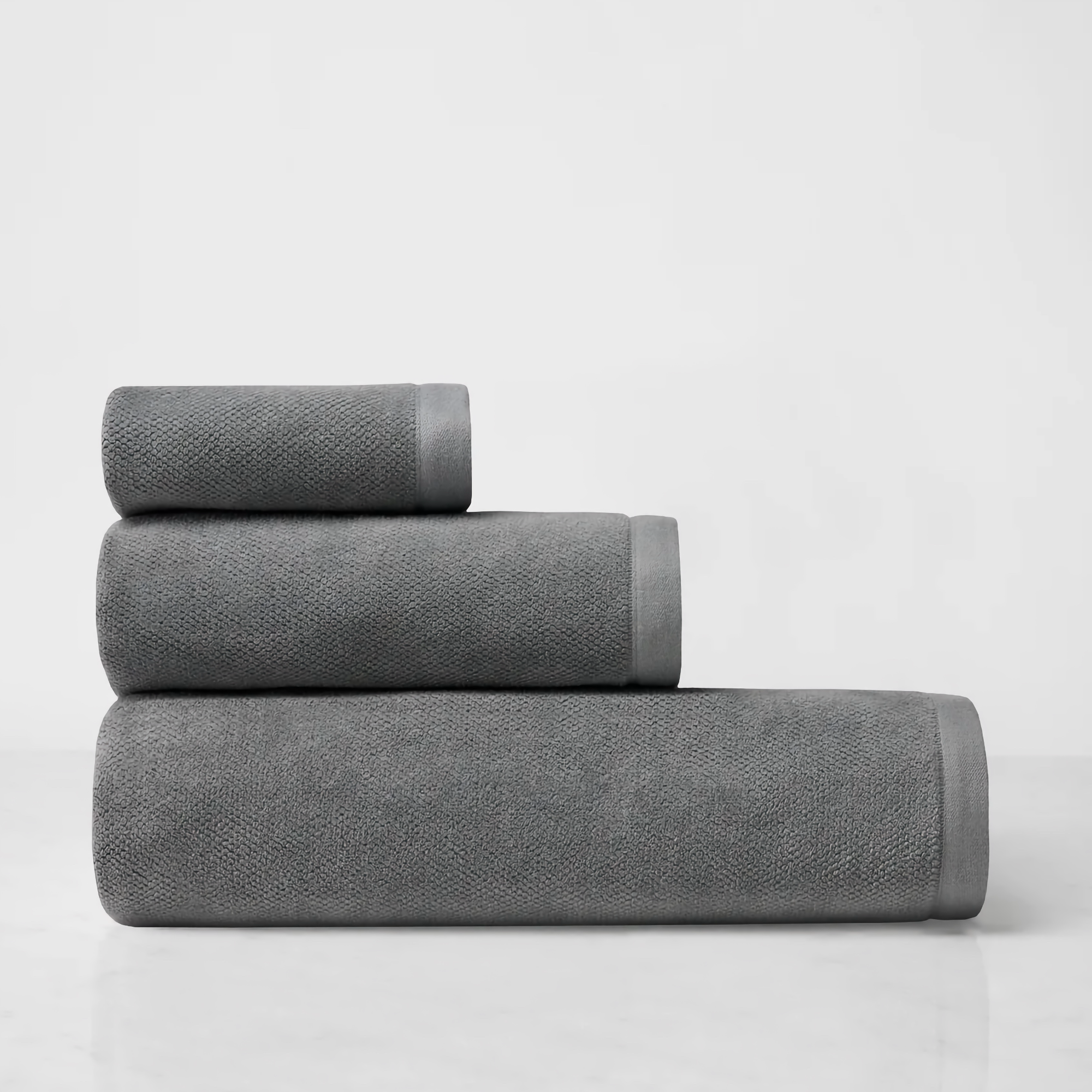 Stack of Sferra Canedo Nuovo Bath Towels in Charcoal