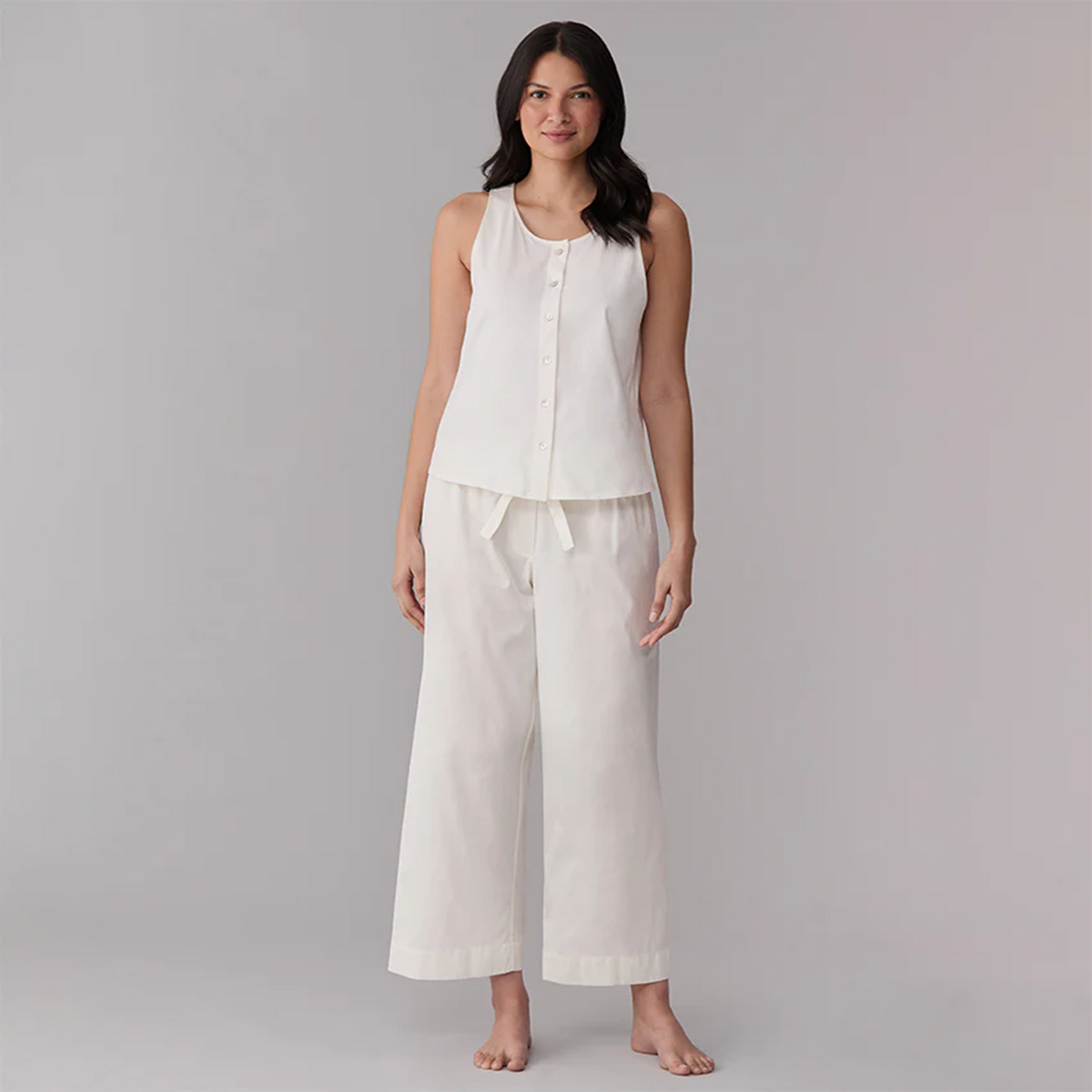 Model Wearing an Ivory Sferra Caricia Buttoned Tank Top and Pajama Pant