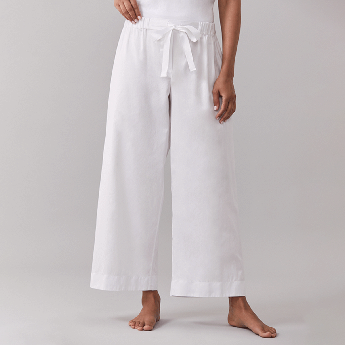 White Sferra Caricia Pant Worn by a Woman Model