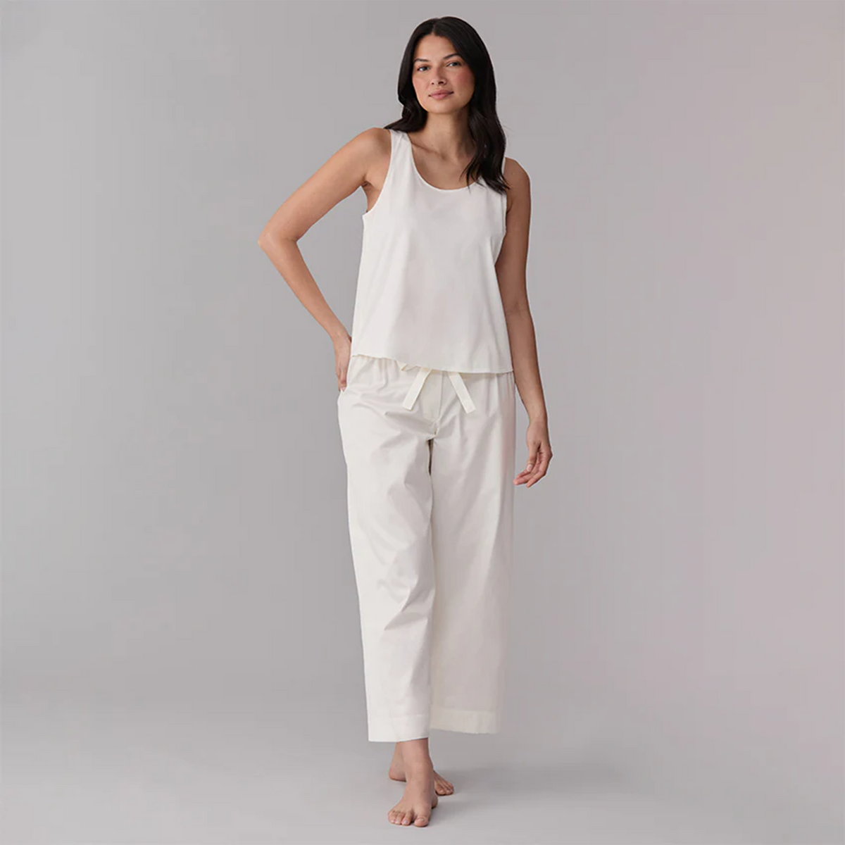 Model Wearing an Ivory Sferra Caricia Swing Tank Top and Pajama Pant