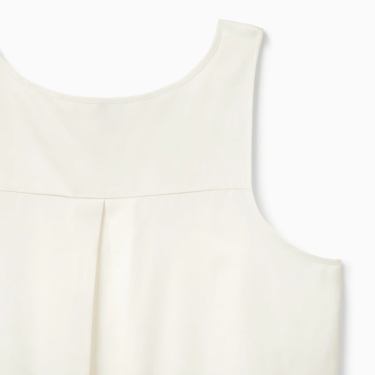 Ivory Corner View of White Sferra Caricia Swing Tank Top against a white background