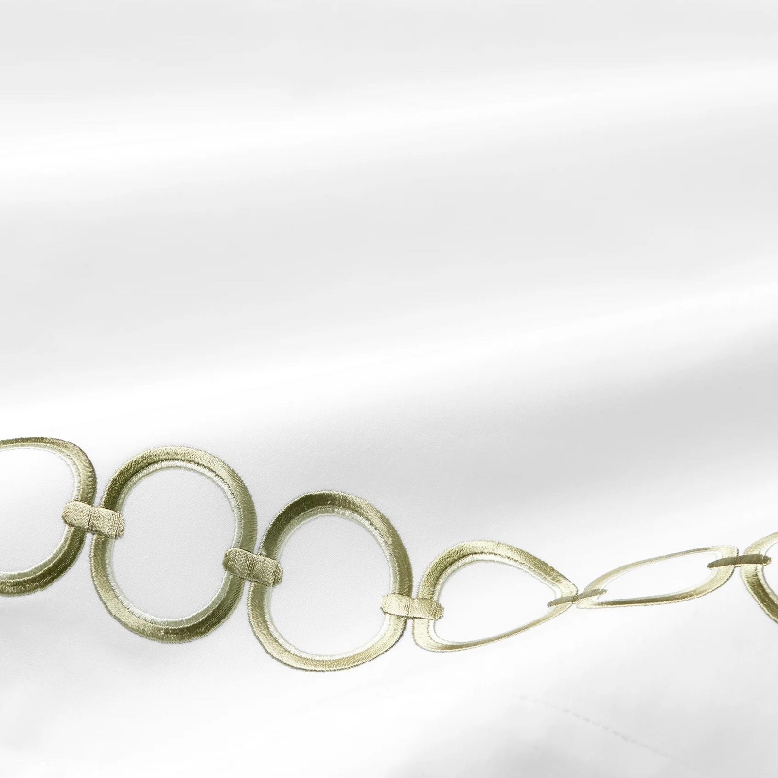 Bed Dressed in Sferra Catena Bedding with Swatch in White/Willow Color