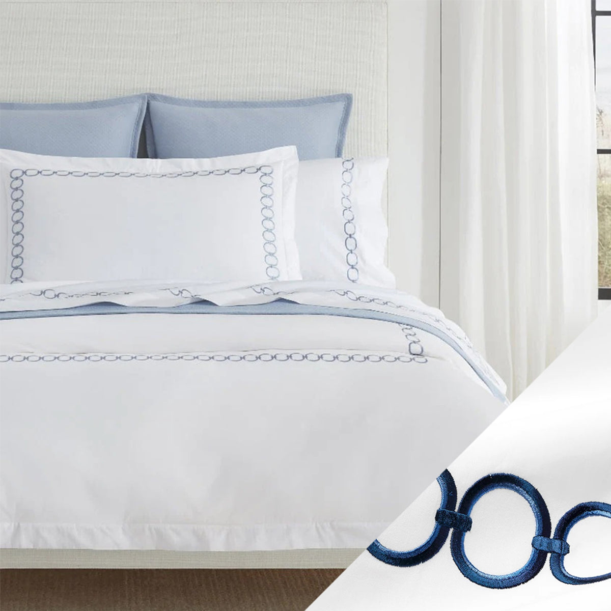 Bed Dressed in Sferra Catena Bedding with Swatch in White/Navy Color