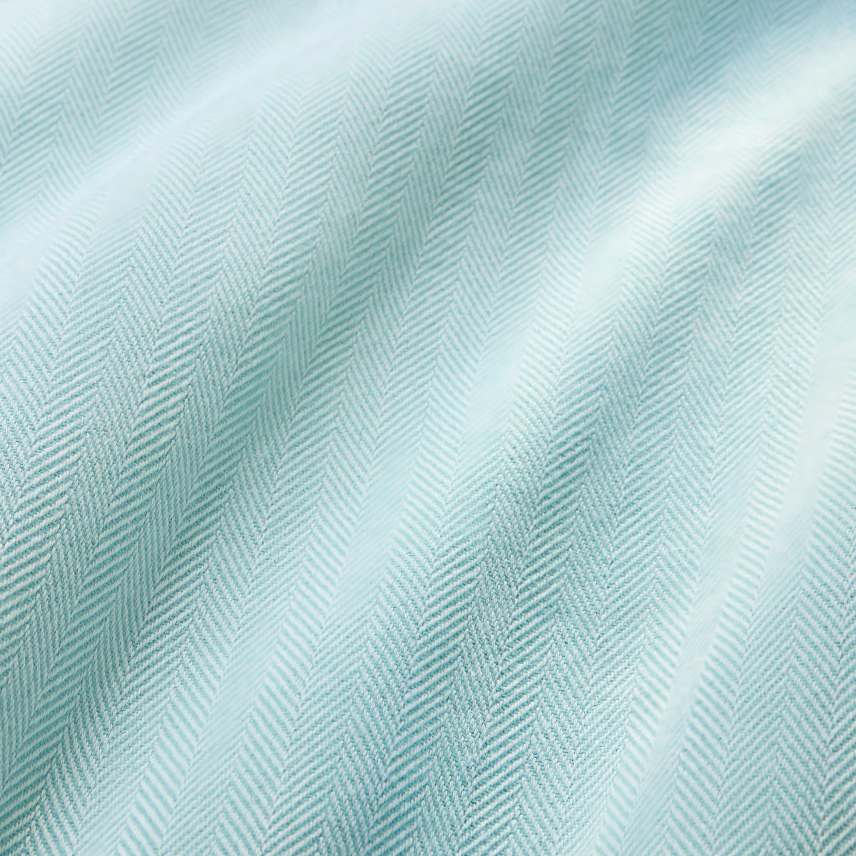 Fabric Closeup of Sferra Celine Throw Blanket in White and Aqua colors