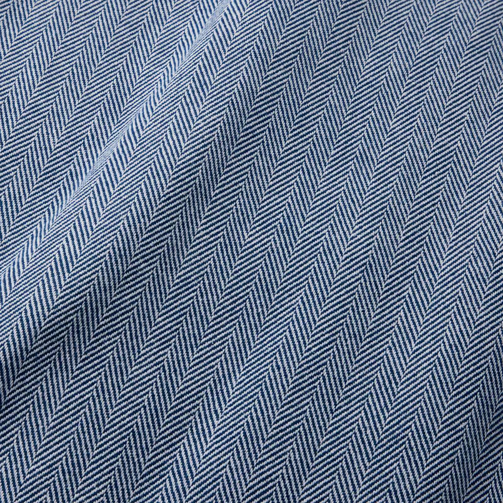 Folded Sferra Celine Throw Blanket in White and Navy