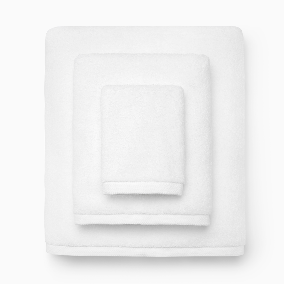 Stack of Folded White Towels from Sferra Cielo Bath Collection