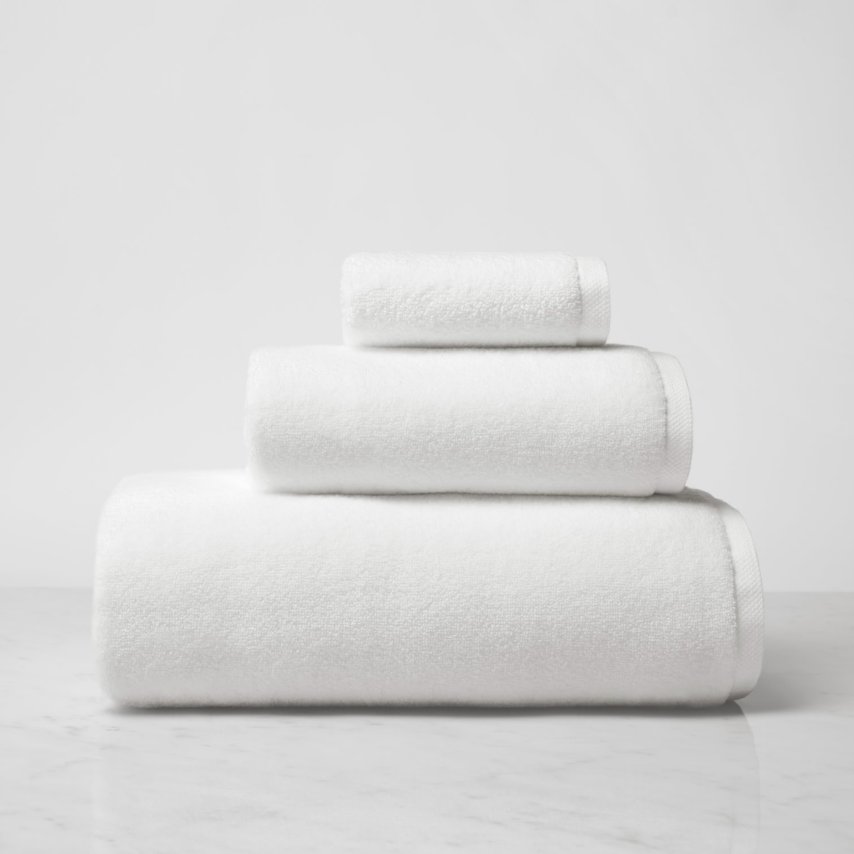 Stack of Sferra Cielo Bath Towels in White