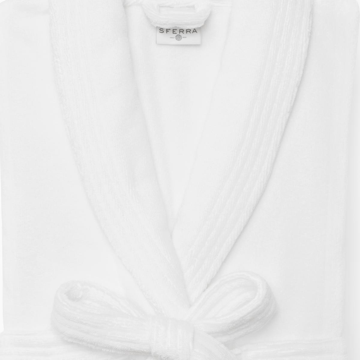 Closeup of Folded Sferra Cielo Robe against a White Background