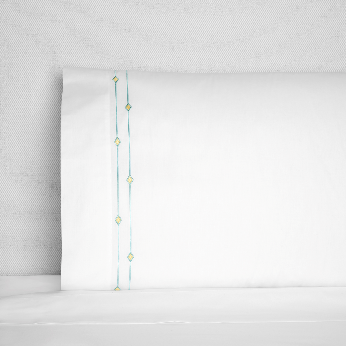 Pillowcase of Sferra Diamantini Bedding in White Aqua Color