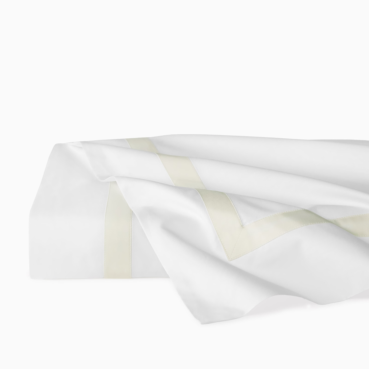 Folded Flat Sheet of Sferra Estate Bedding in White and Ivory