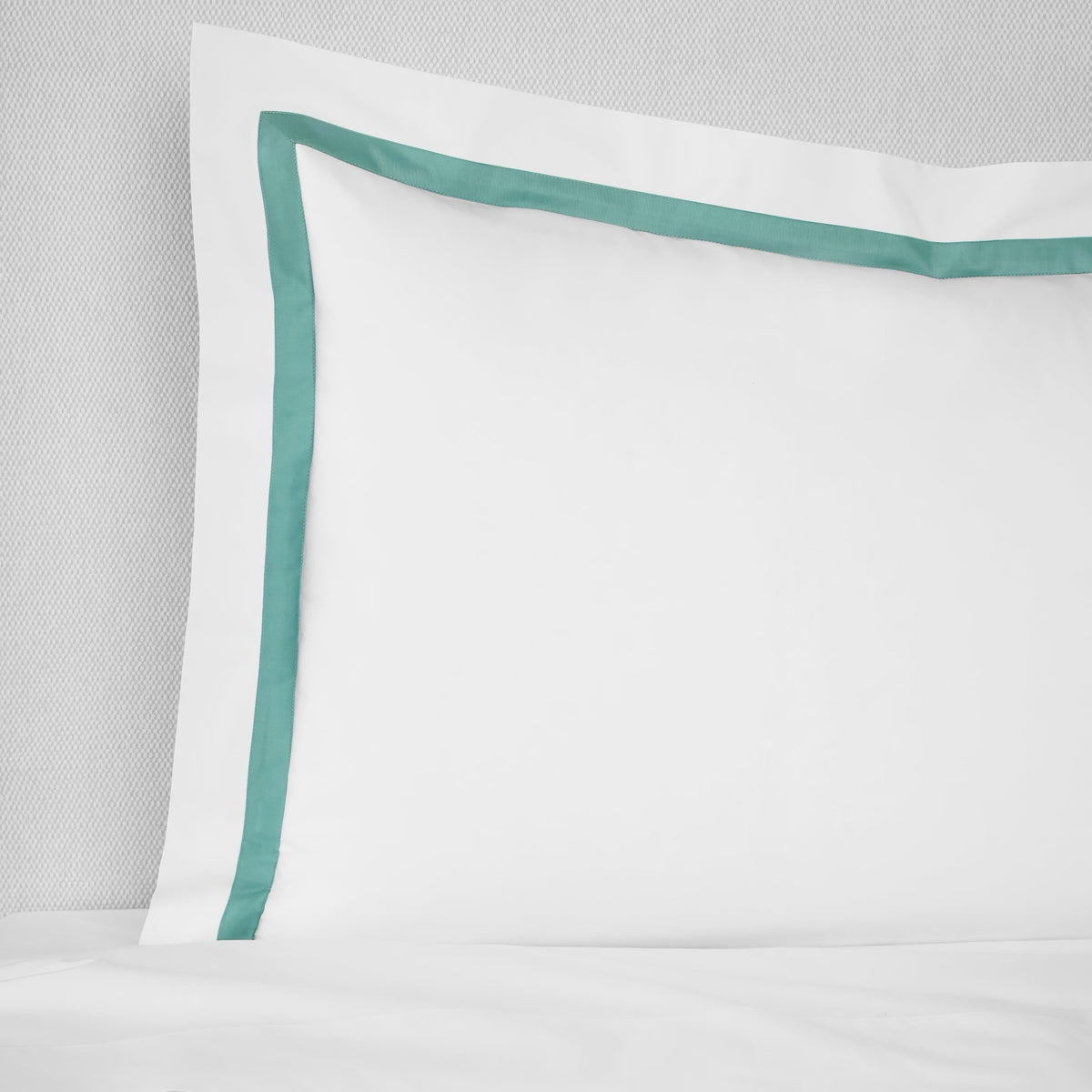 Sham Closeup of Sferra Estate Bedding in White and Aqua color