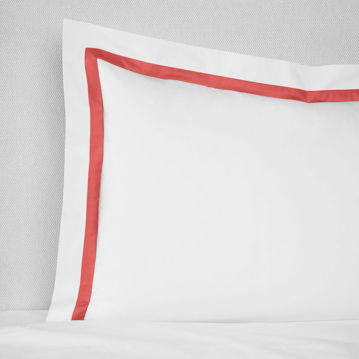 Sham Closeup of Sferra Estate Bedding in White and Persimmon color