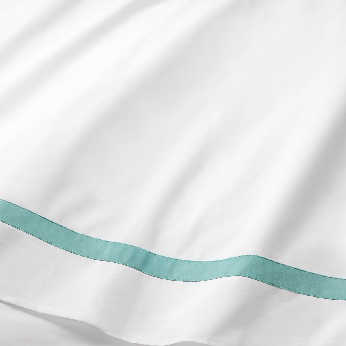 Fabric of Sferra Estate Bedding in White and Aqua color