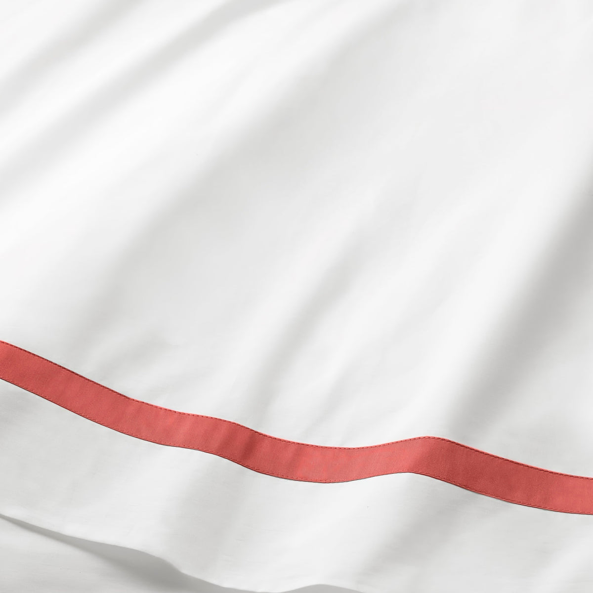 Fabric of Sferra Estate Bedding in White and Persimmon color