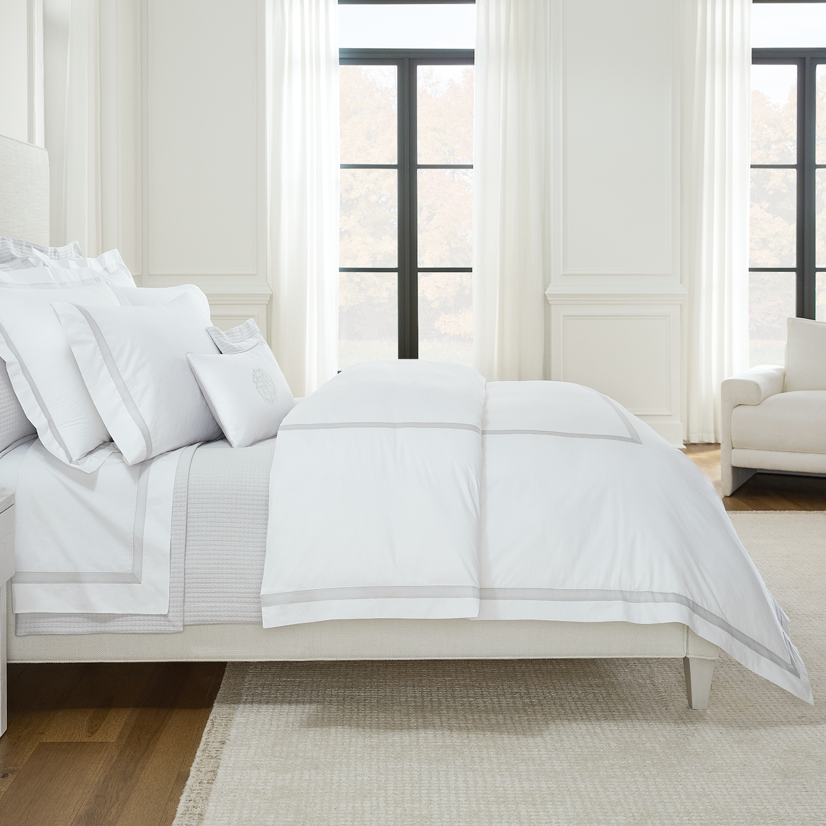 Sideview of Full Bed Dressed in Sferra Estate Collection White Lunar Color