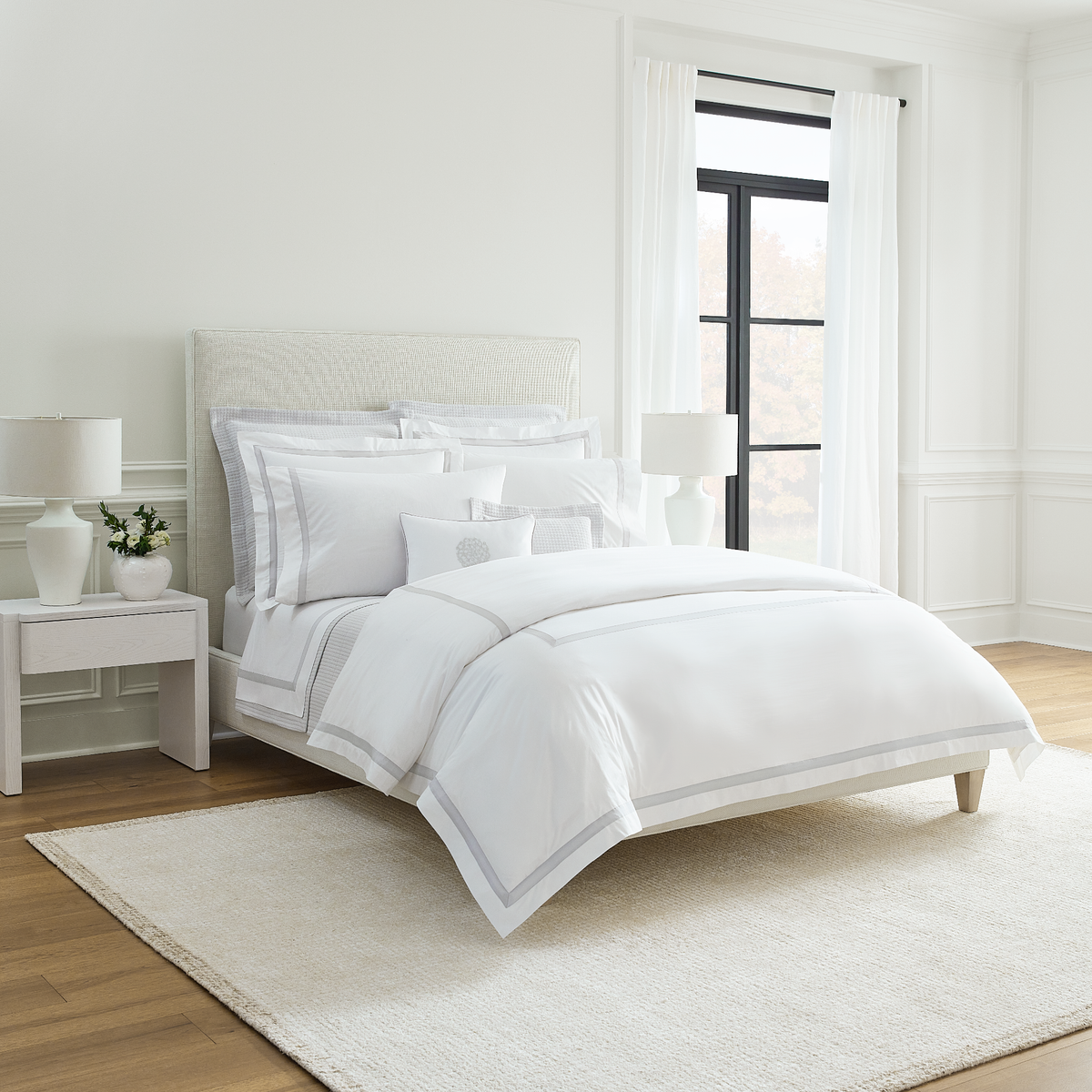 Corner View of Full Bed Dressed in Sferra Estate Collection White Lunar Color