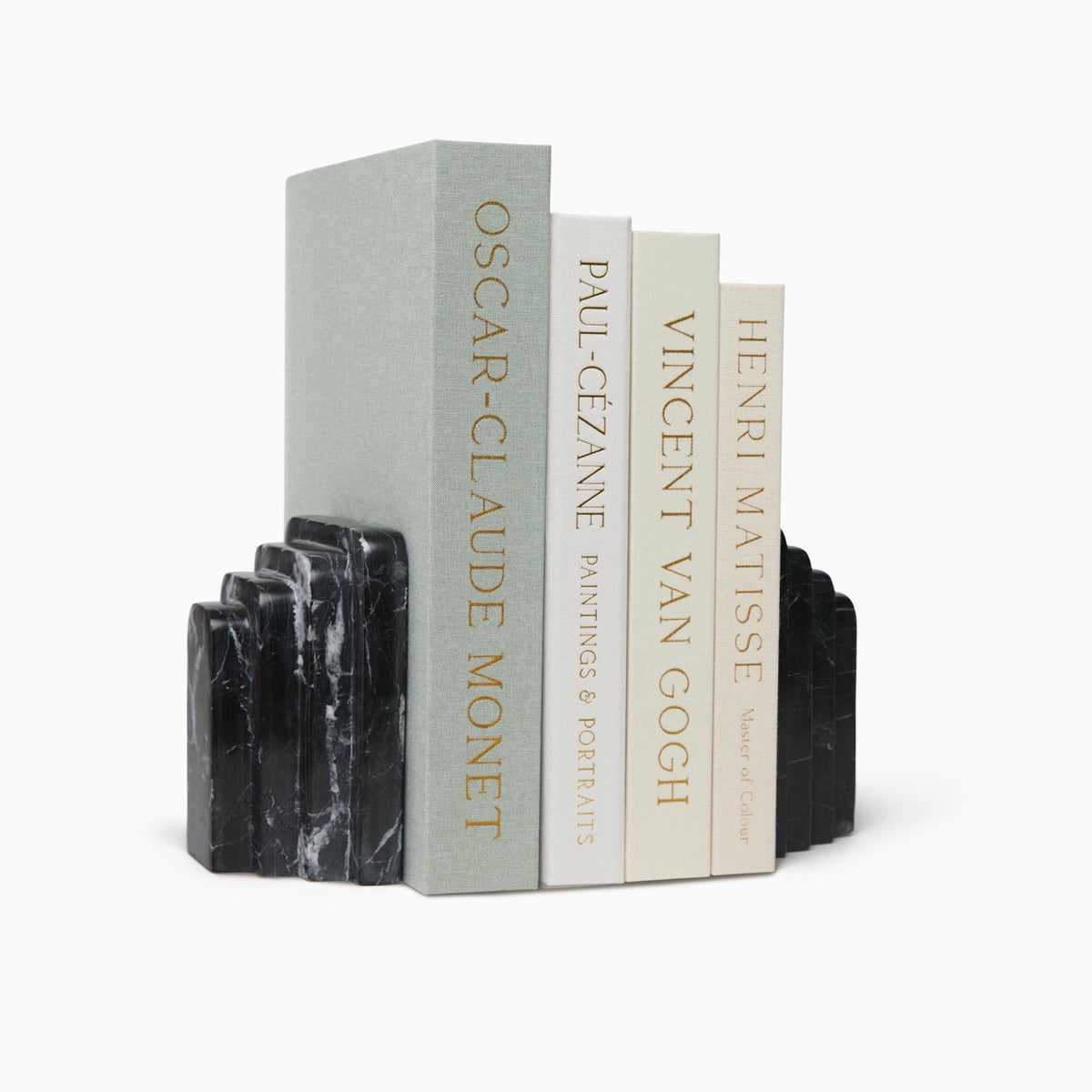 Angled View of Sferra Fermalibri Marble Bookends in black with books