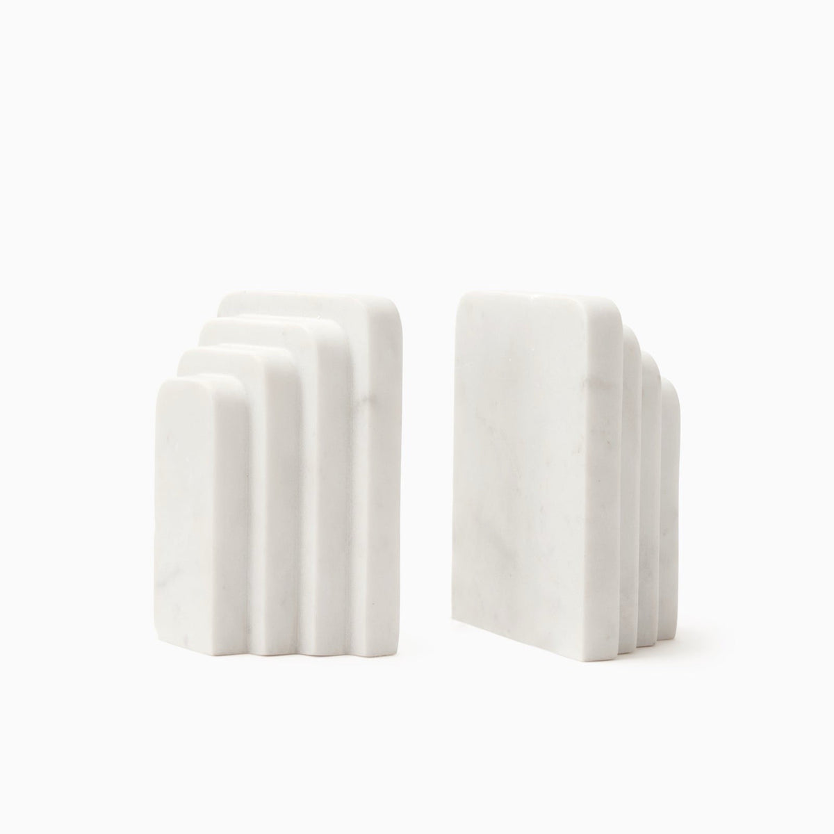 Angled View of Sferra Fermalibri Marble Bookends in white