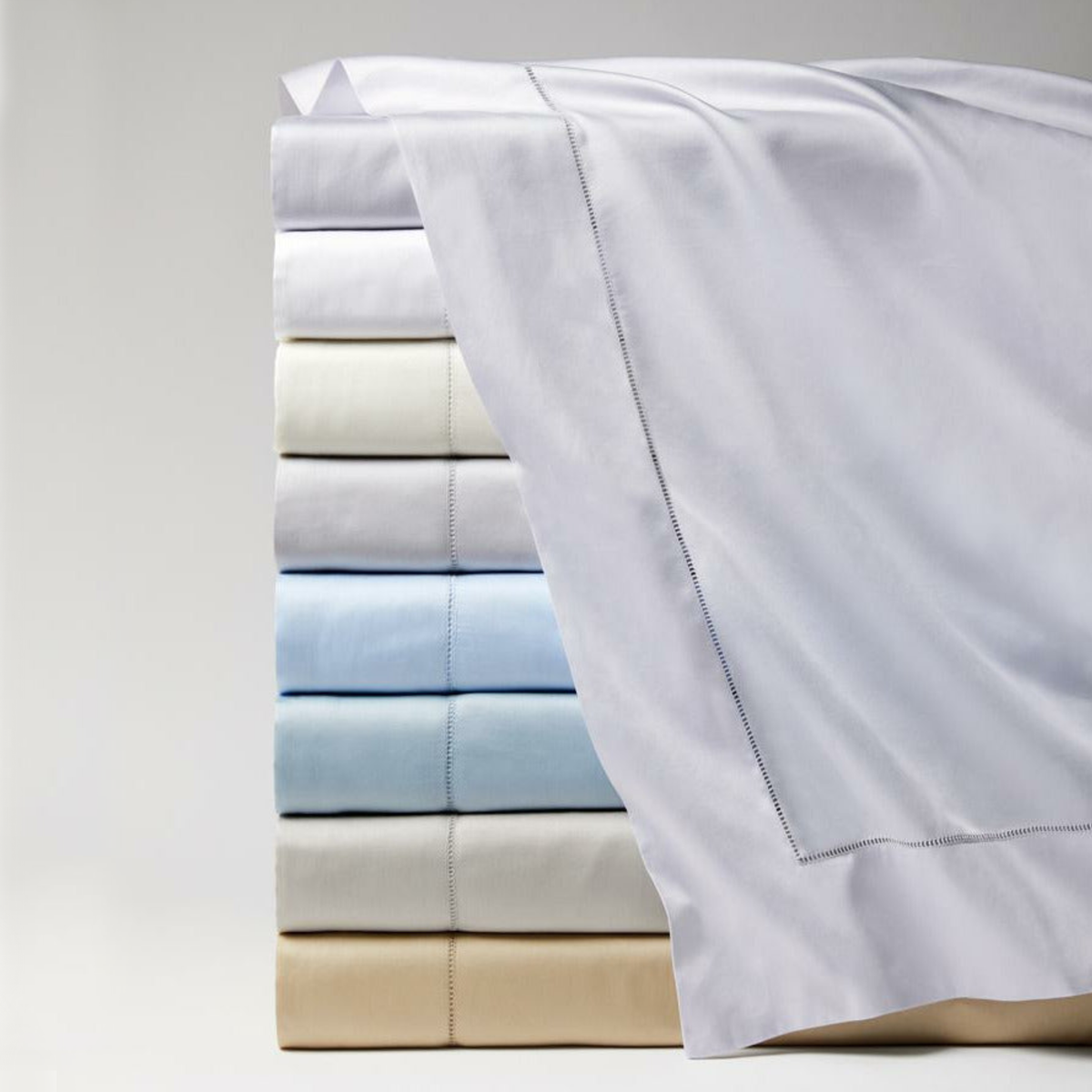 Stack of Folded Sferra Fiona Bedding in All Colors