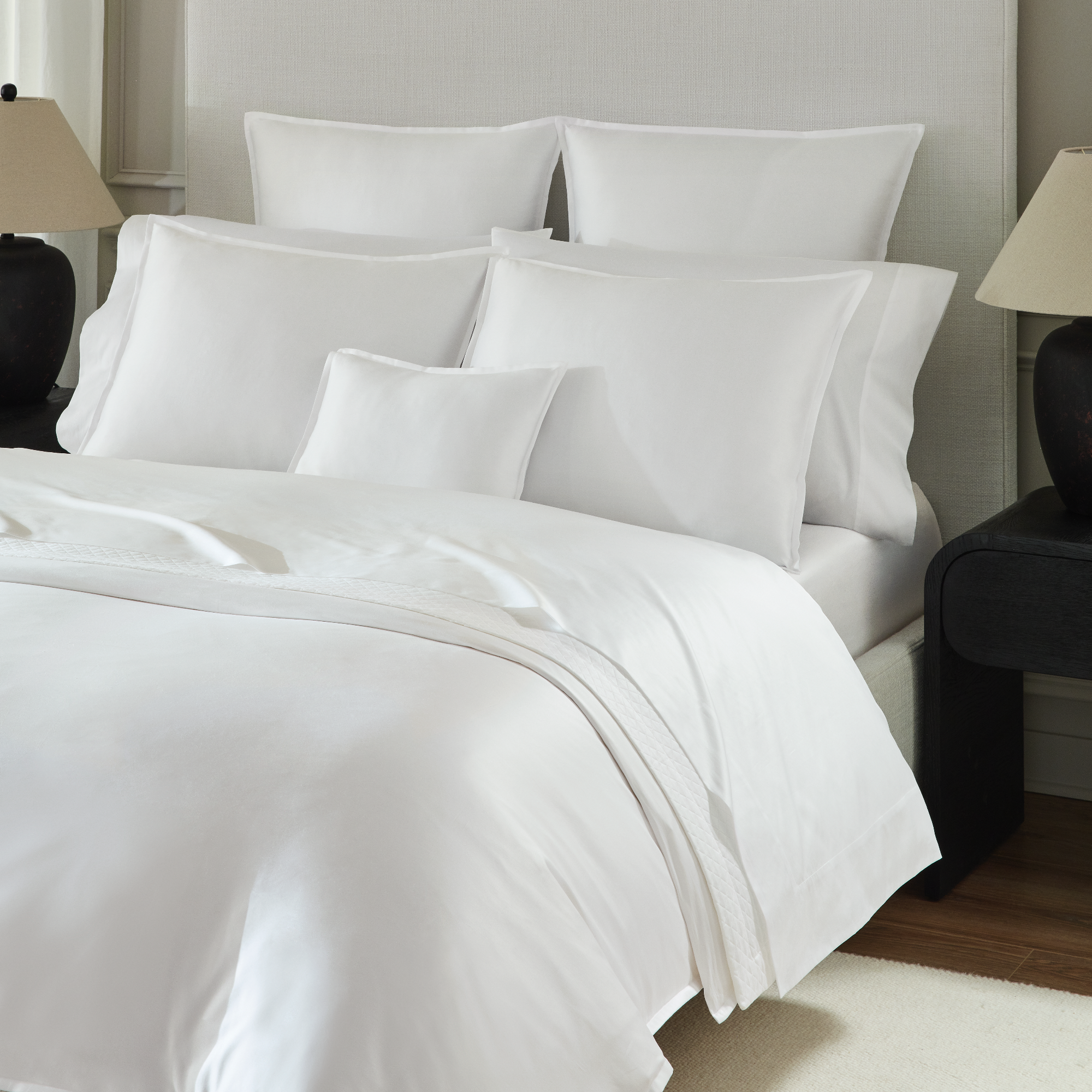 Angled View of Full Bed Dressed in White Sferra Giza 45 Corto Sateen Collection