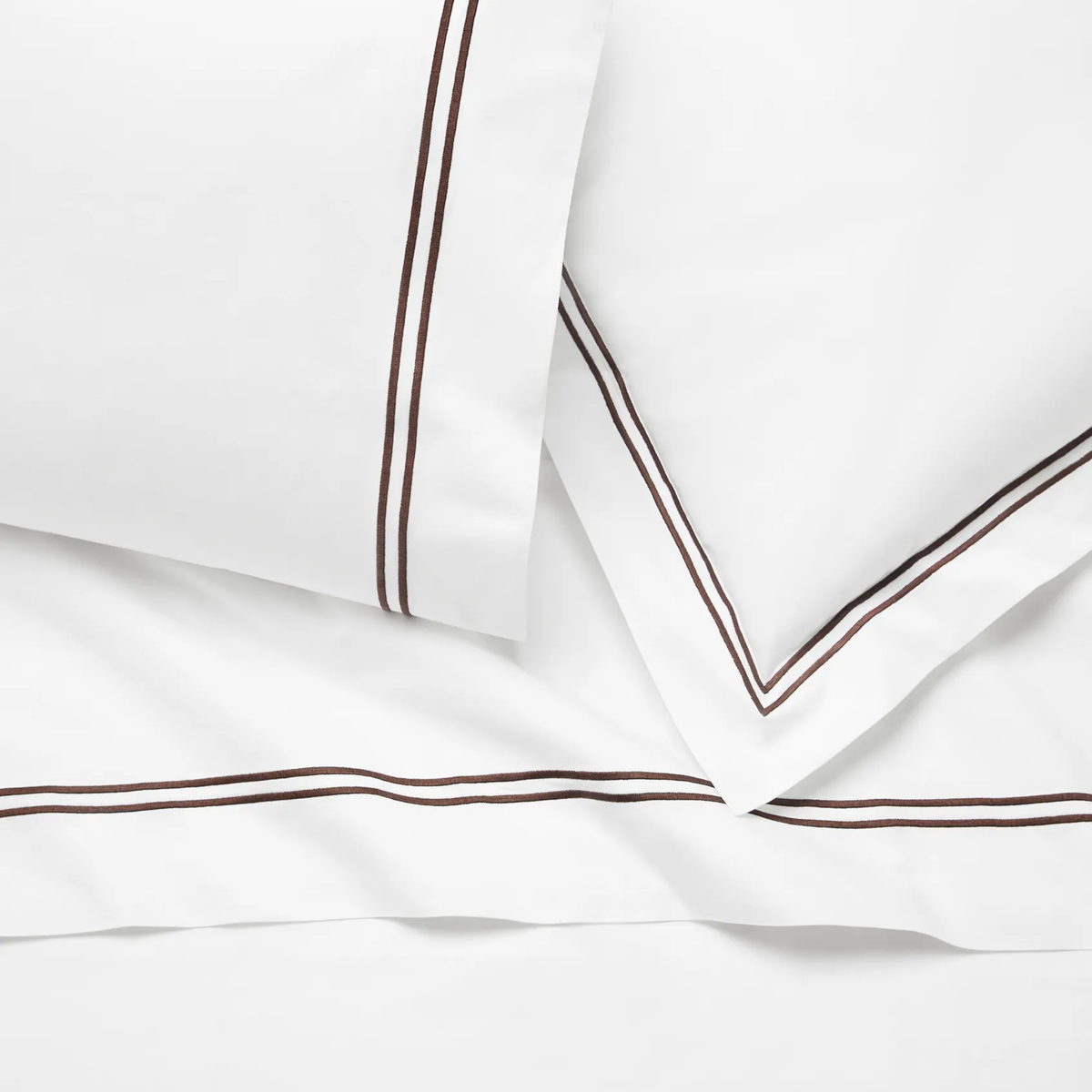 Closeup of Sferra Grande Hotel Bedding in White and Mocha colors
