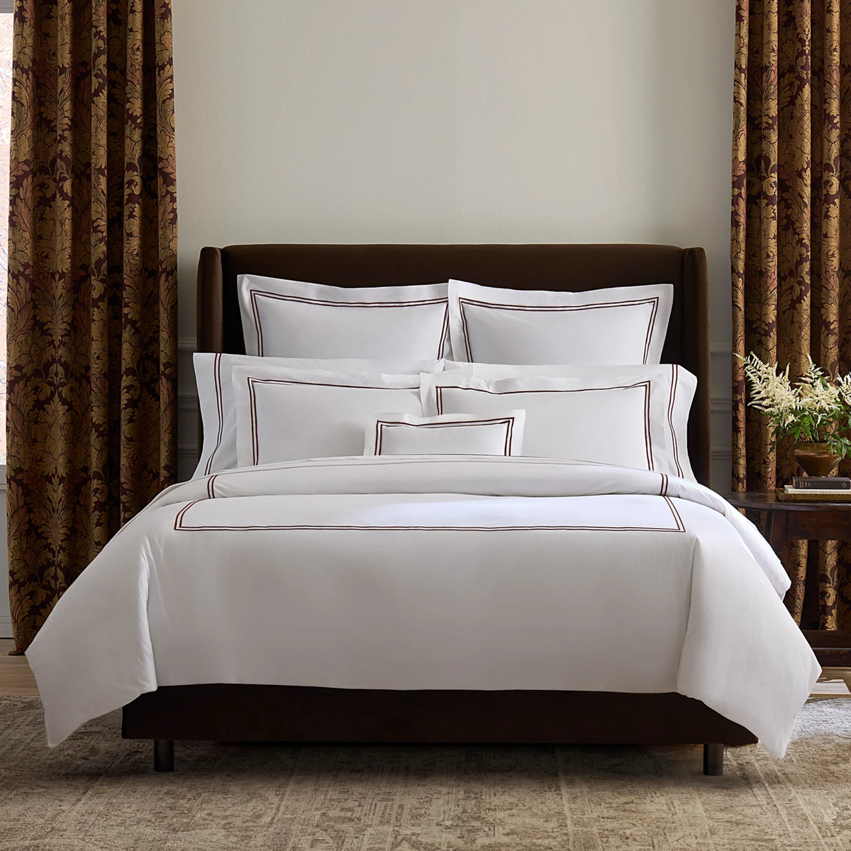 Bed arranged with Sferra Grande Hotel Bedding in White and Mocha