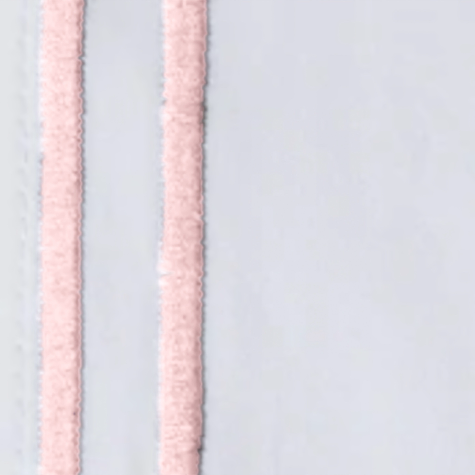 Stack of Sferra Grande Hotel Sheet Sets White/Pink