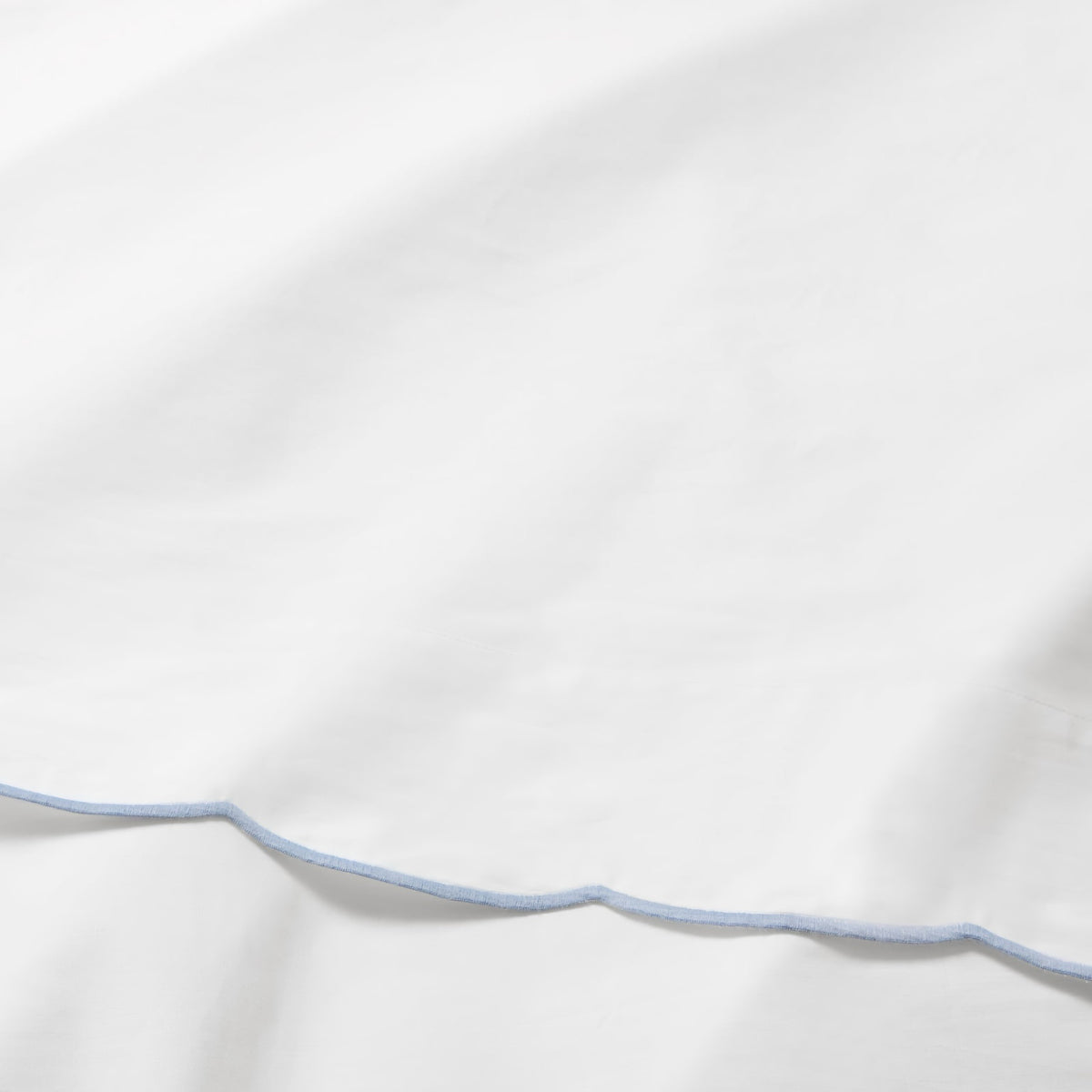 Swatch of Sferra Limana Bedding in White/Sea Color