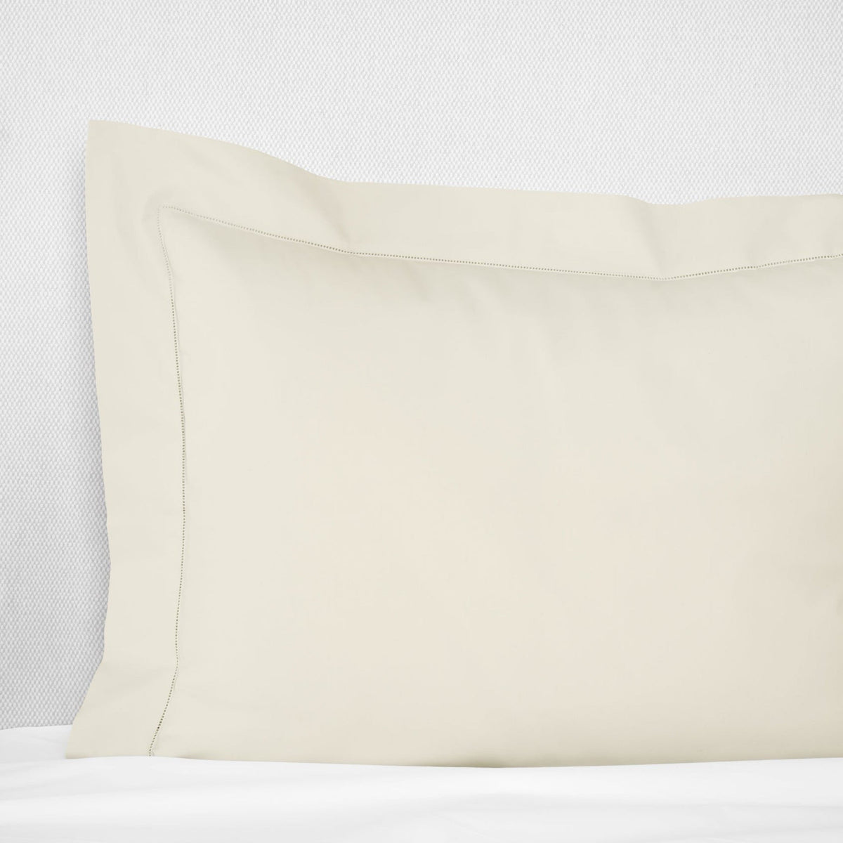 Sham Corner View of Beige Sferra Luxor Bedding