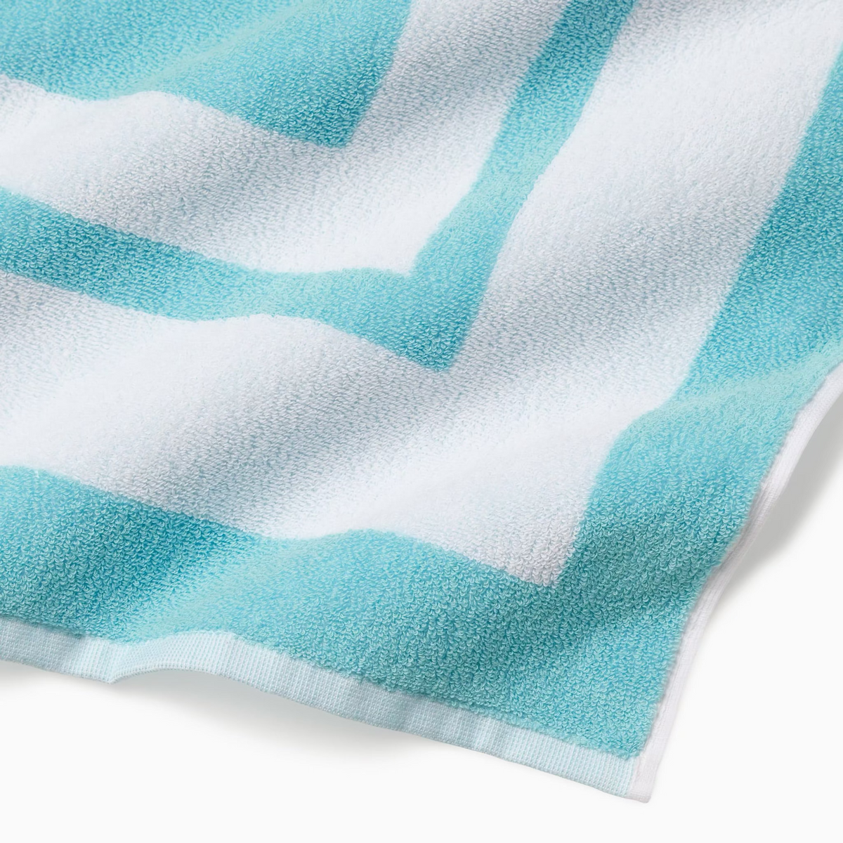Corner Detail of Sferra Mareta Beach Towels in Clearwater color