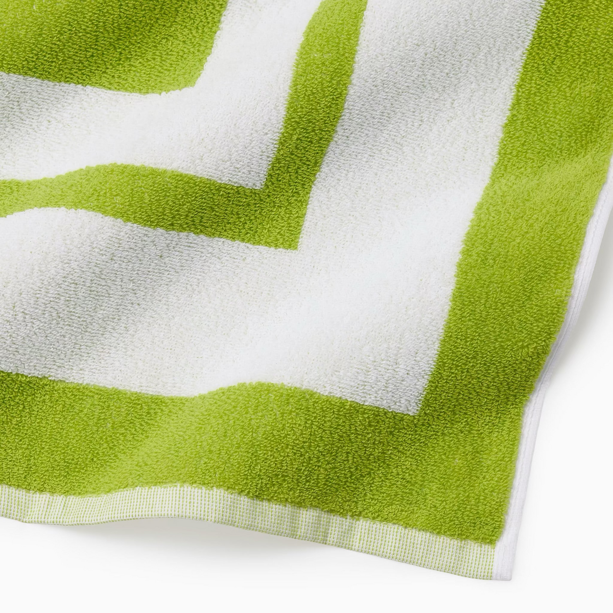 Corner Detail of Sferra Mareta Beach Towels in Kiwi color