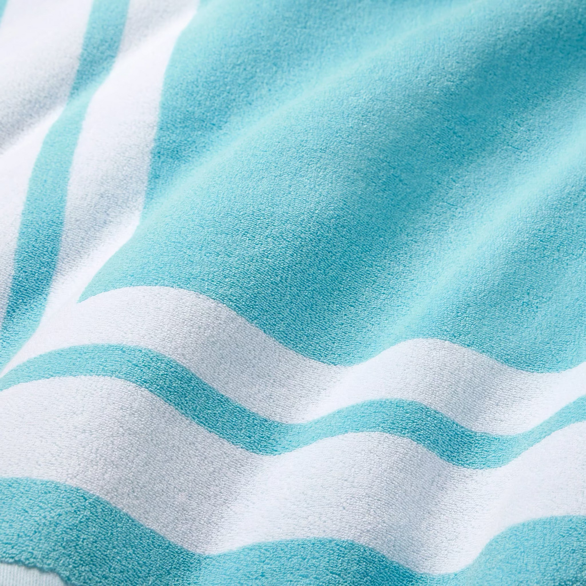 Closeup of Sferra Mareta Beach Towels in Clearwater color
