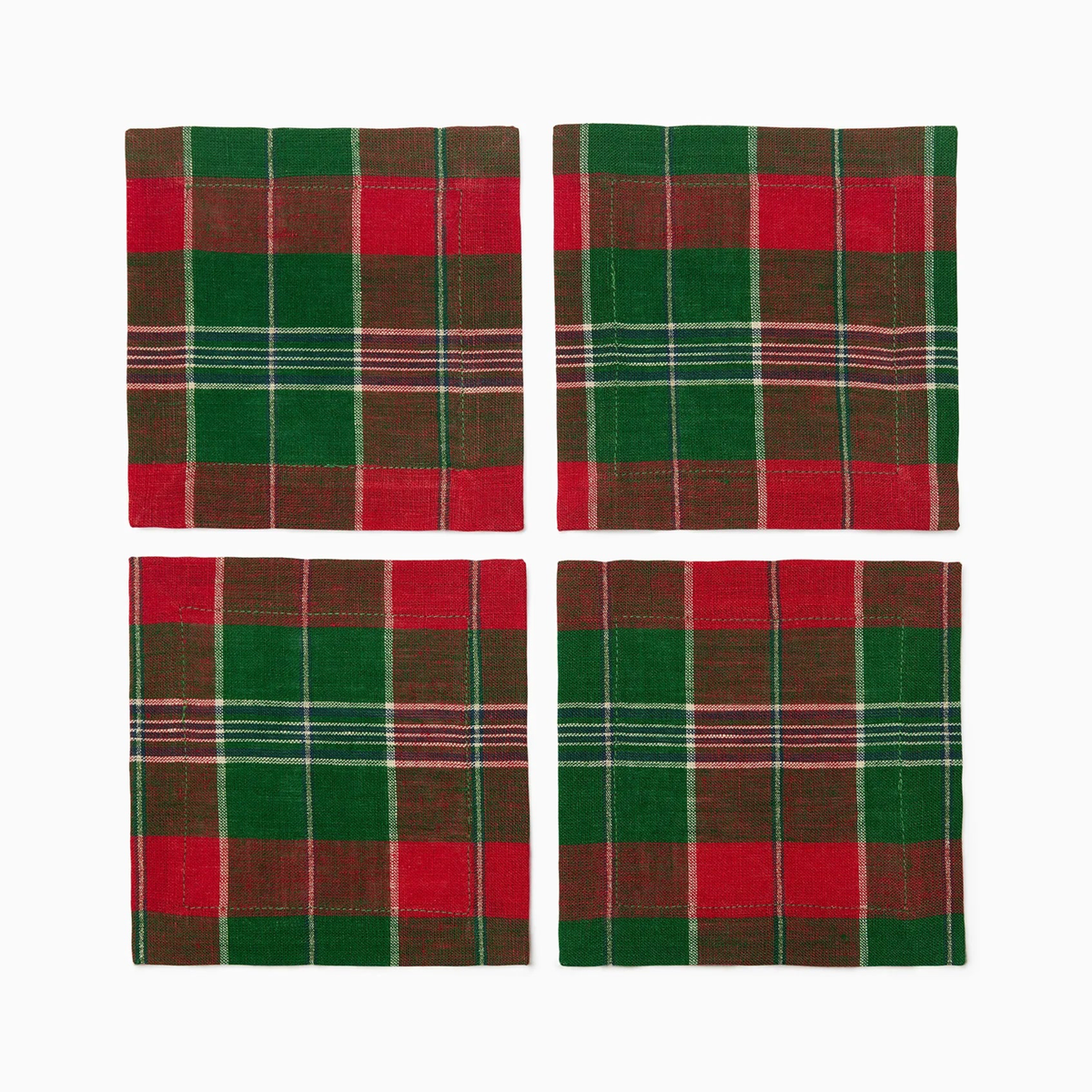 Four square plaid Sferra Masseria Cocktail Napkins in Emerald and Red colors on a crisp white background