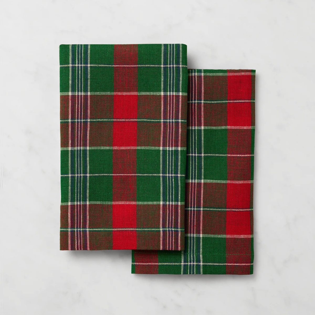 Two folded plaid Sferra Masseria Guest Towels in Emerald and Red colors - add charm to your autumnal table decor