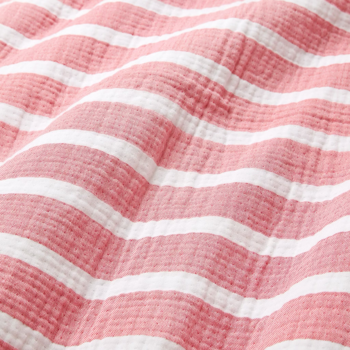 Fabric Closeup of Sferra Merlata Beach Towel in Coral color