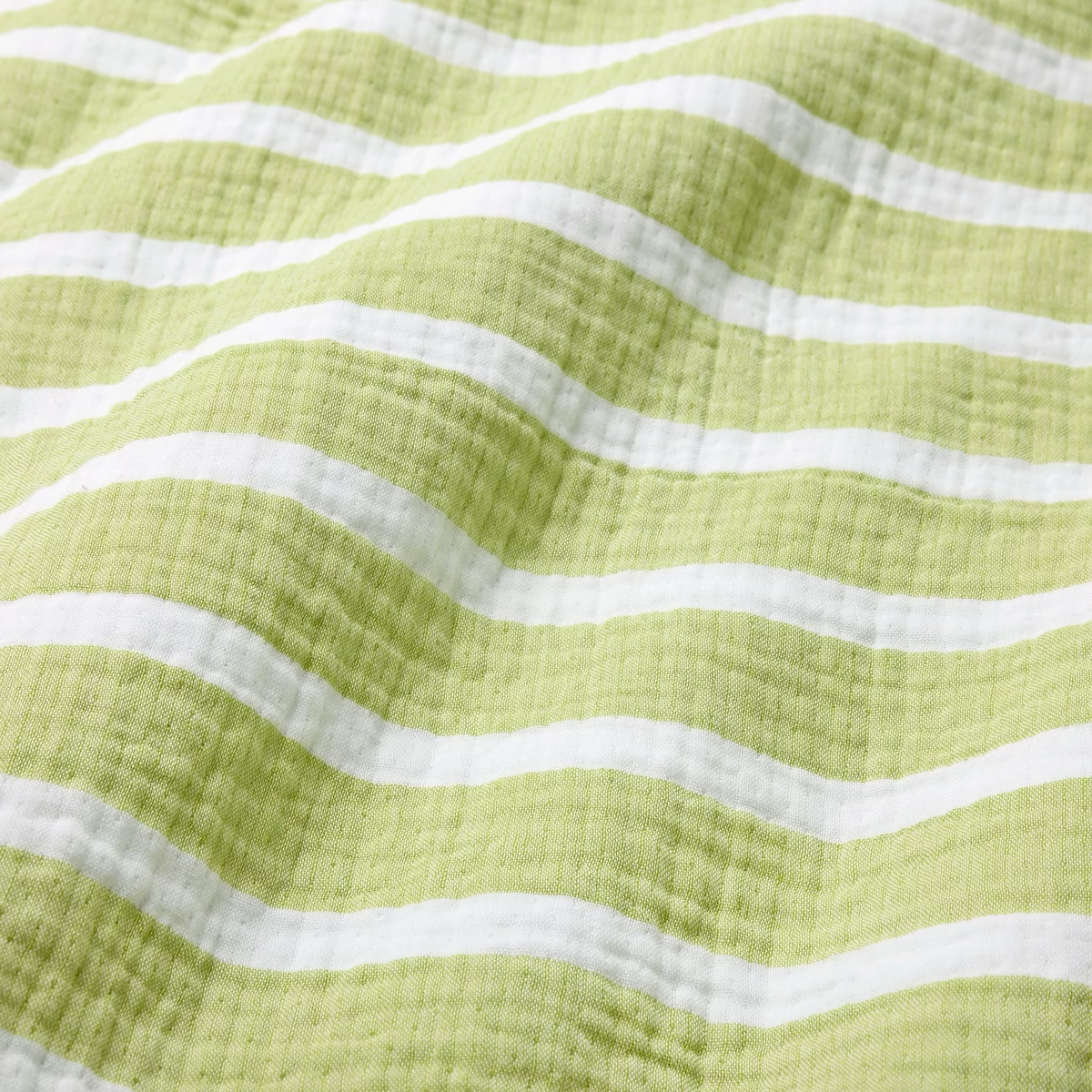 Fabric Closeup of Sferra Merlata Beach Towel in Kiwi color