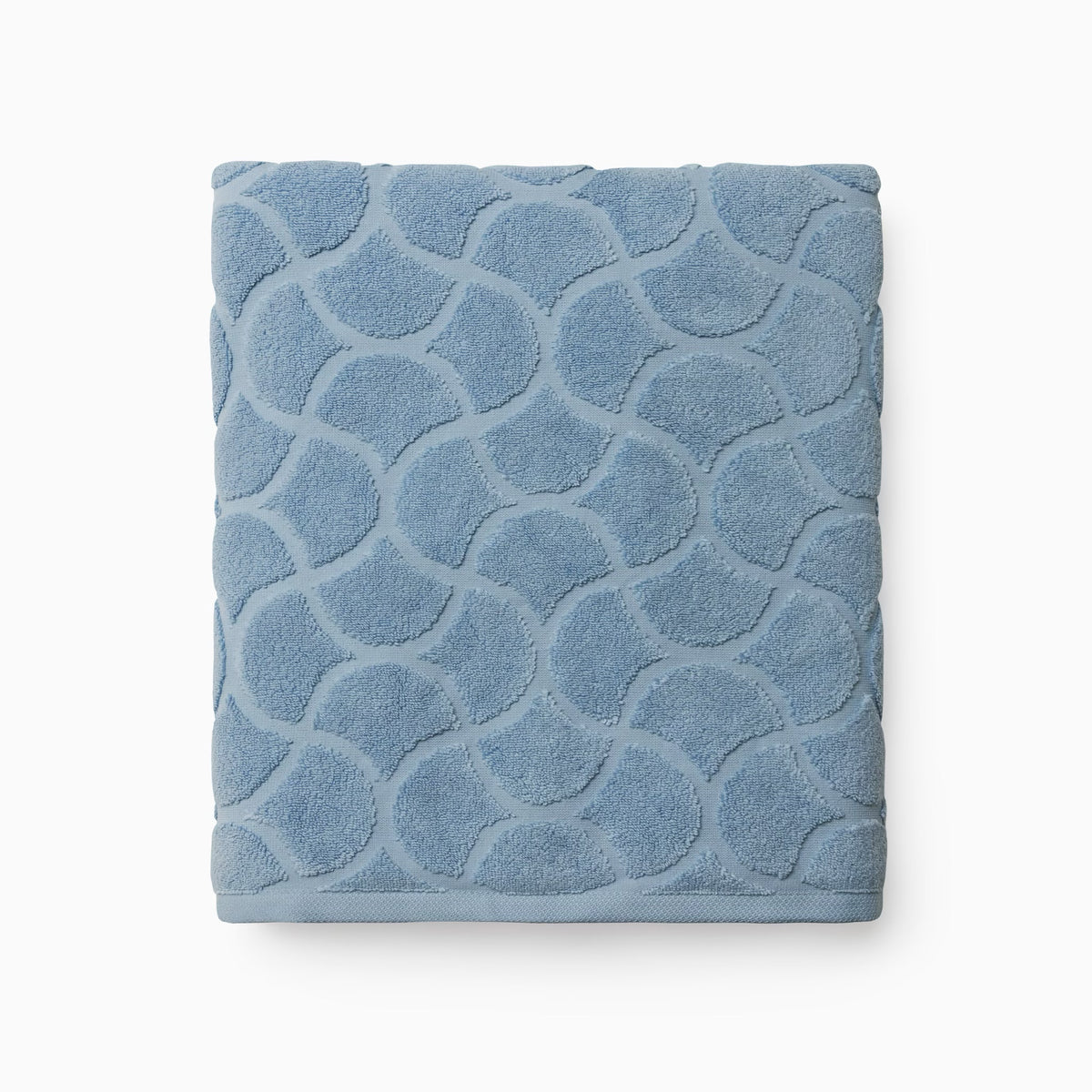 Folded Sferra Oasi Bath Sheet in Sea color
