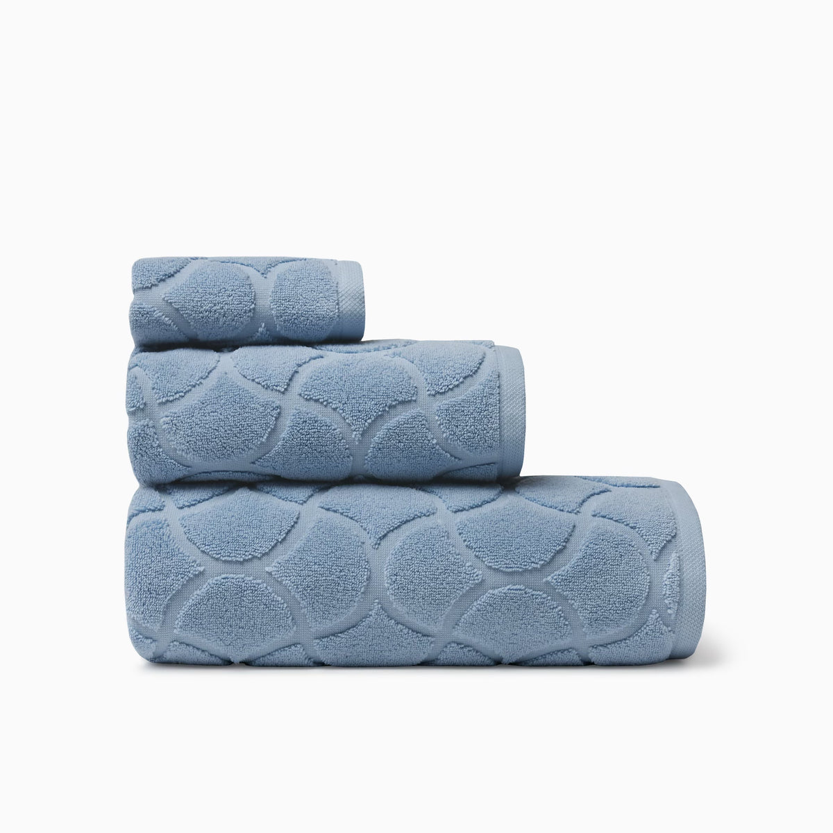 Stack of Sferra Oasi Bath Towels in Sea color