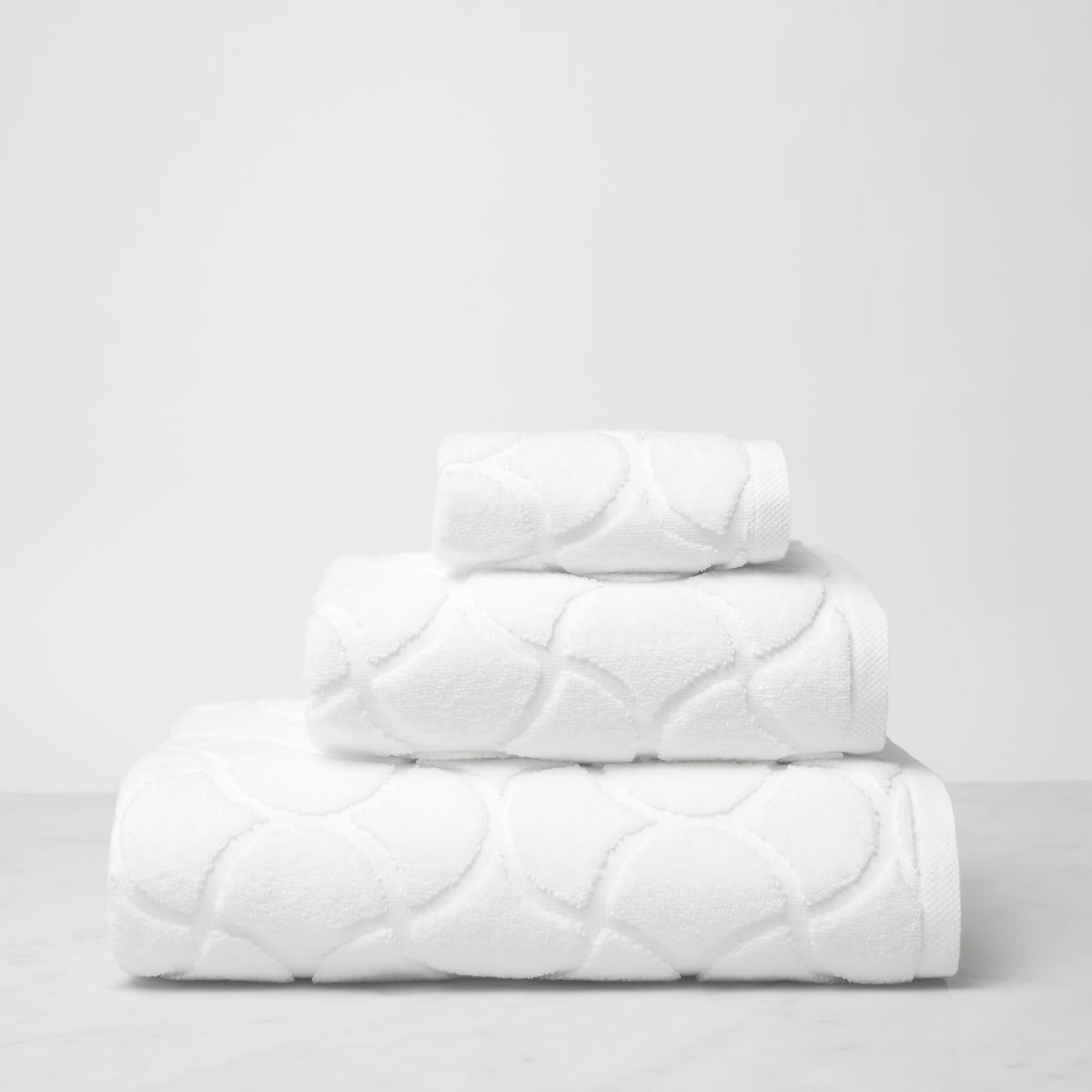 Stack of Sferra Oasi Bath Towels in White color
