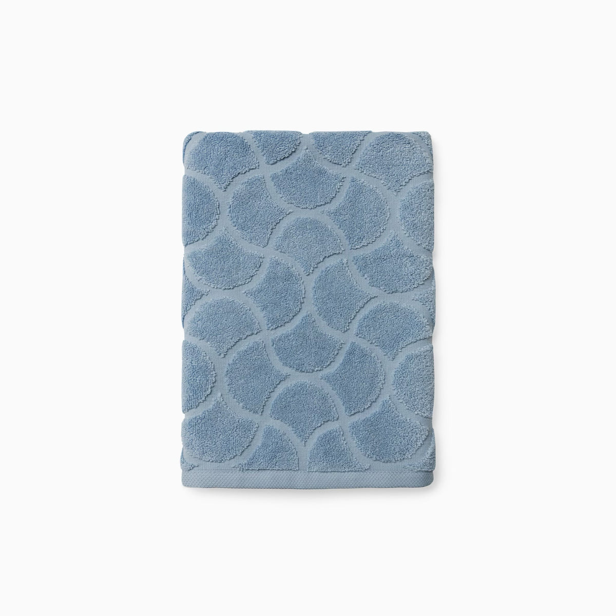 Folded Sferra Oasi Hand Towel in Sea color