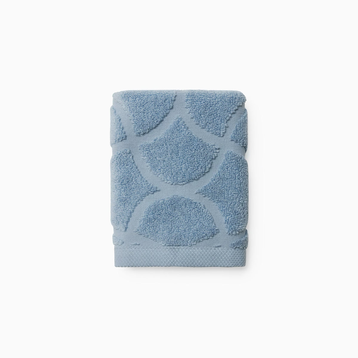 Folded Sferra Oasi Washcloth in Sea color