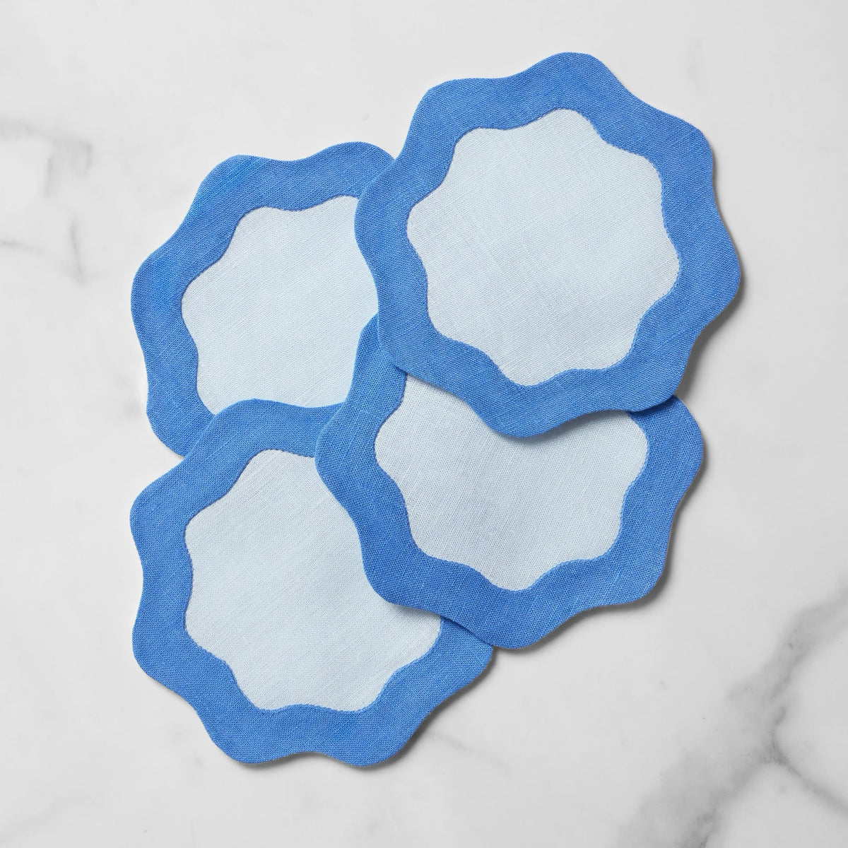 Stack of Sferra Cocktail Napkins in Sky and Cobalt