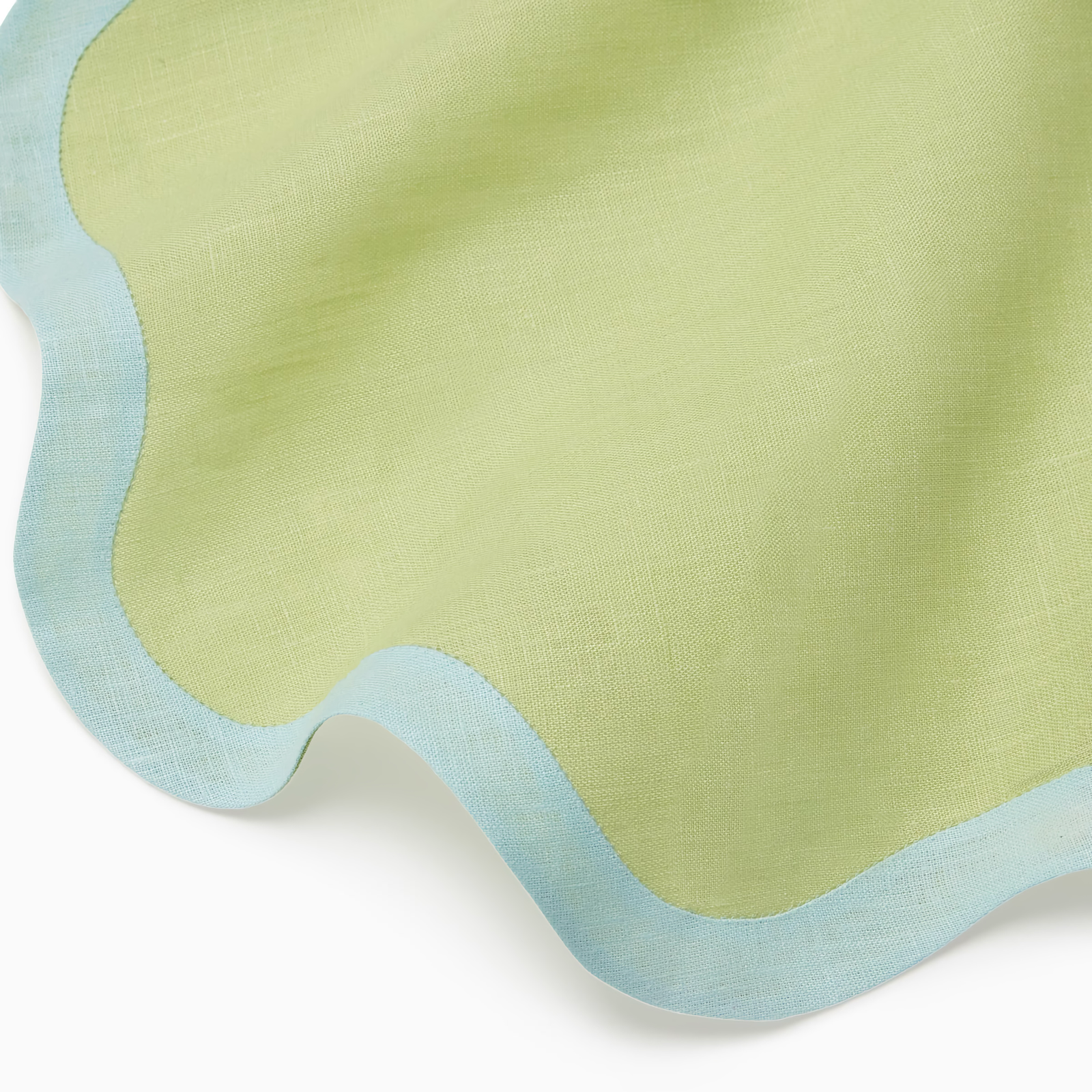 Sferra Ondulato Table Linens in Kiwi and Clearwater