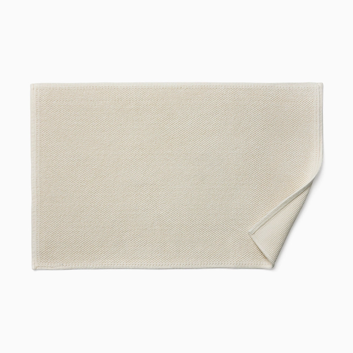 Sferra Osini Bath Rug in Ivory with fold