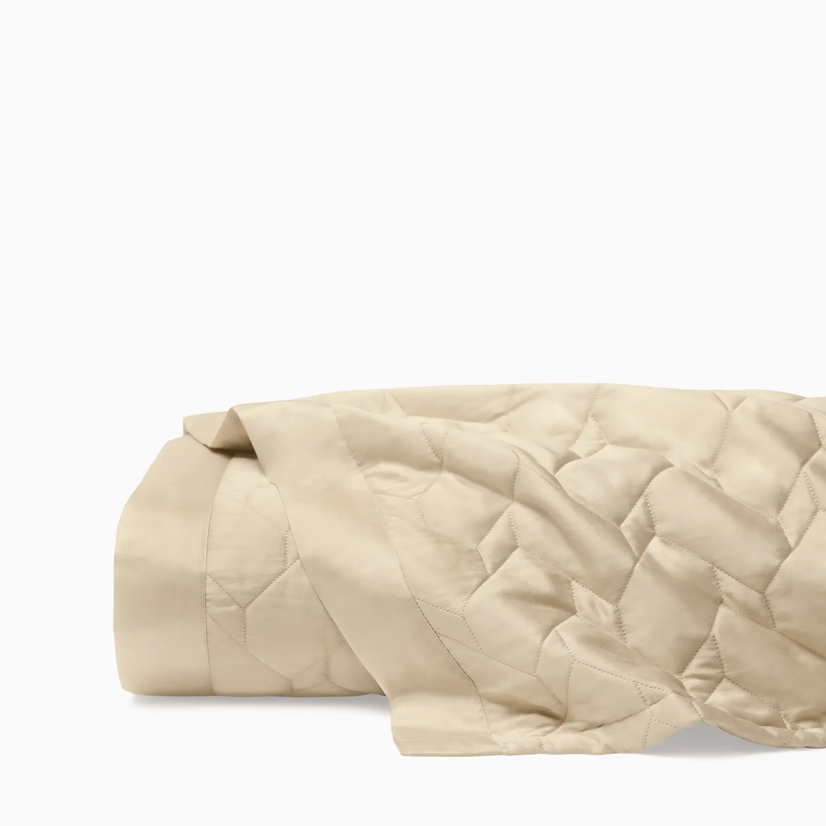 A folded Sferra Palatino Quilt in Sand color is shown against a plain white background