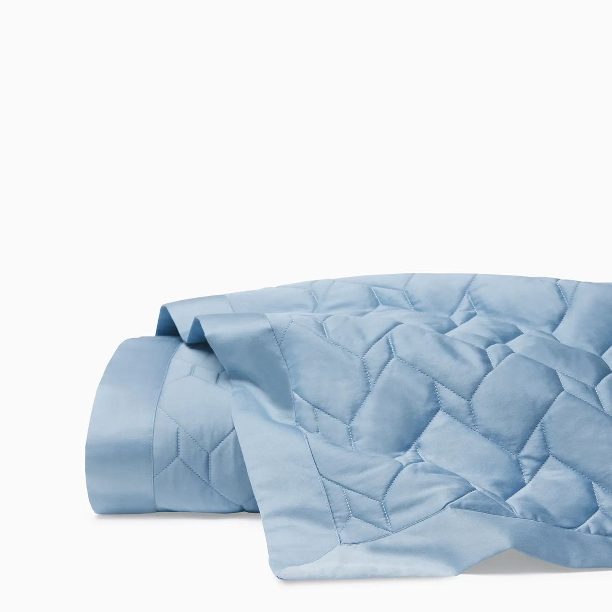 A folded Sferra Palatino Quilt in Sea color is shown against a plain white background